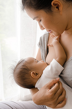 Woman breastfeeding a baby