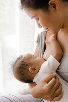 Woman breastfeeding an infant