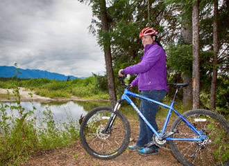 Woman cycling in Kitimat